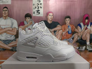 Side profile of a white high-top sneaker showing the layered panel construction, molded lace support, sculpted midsole, and textured outsole.