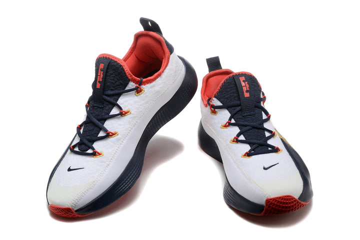 Pair of white, navy, red, and gold Nike LeBron training shoes shown from the front
