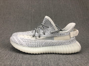 Side profile showing the knit-style upper, translucent-looking side panel and ribbed sole.