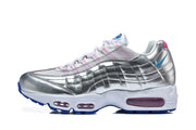 Side view of a silver Nike Air Max 95 sneaker with blue swoosh and pink-tinted air units