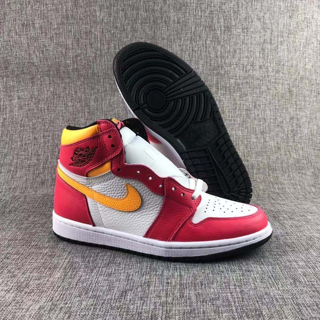 Air Jordan 1 high-top sneakers shown from the side and outsole, featuring red, white and yellow panels.