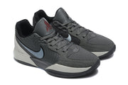 Close three-quarter view of the gray and black Jordan sneaker pair.