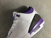 Close-up of the side panel, purple collar lining, perforated eyestay, and patterned heel overlay.