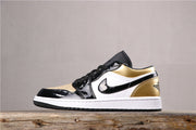 Side profile showing the black toe cap, white side panel, black detailing, metallic gold collar and rubber outsole.
