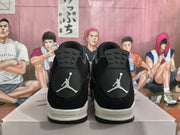 Rear view of black and white high-top sneakers showing contrasting heel logos and layered outsoles.