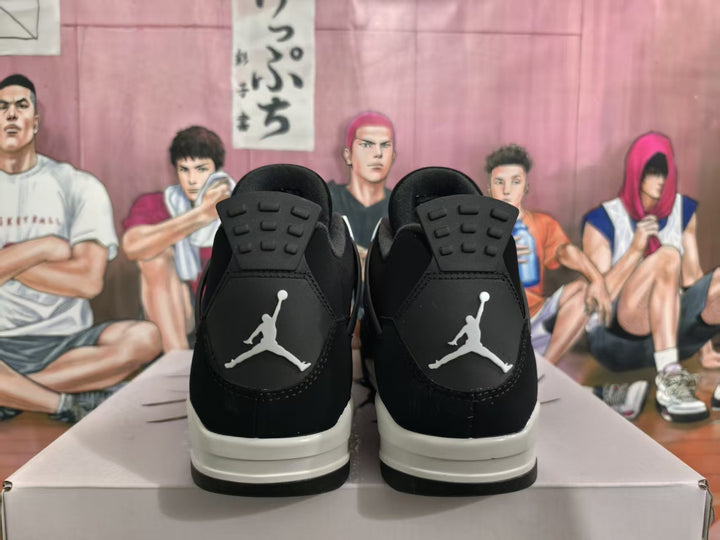 Rear view of black and white high-top sneakers showing contrasting heel logos and layered outsoles.