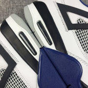 Close-up of the black side overlay, mesh panel, blue midsole accent, and heel air window.