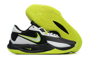 Black and white basketball shoe with neon green accents and a bright green outsole.