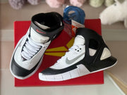 Top and side view showing the laces, padded collar, ankle strap, and contrasting panels.