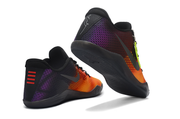 Black, orange, and purple Kobe 11 shoes shown from the heel and outsole