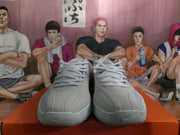 Front view of a pair of Nike basketball sneakers showing white laces, perforated toe panels, and NIKE branding on the outsoles.