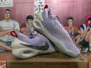 Angled view of the lavender Nike basketball sneakers displaying the side panels, heel construction, red pull tabs and outsole pattern.