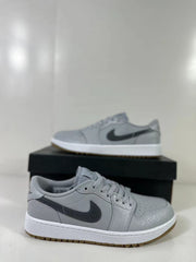 Angled side view of the grey low-top sneaker with dark Swoosh branding.