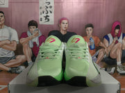 Front view of the mint green Jordan sneakers showing the laces, padded tongues, and contrasting outsole.