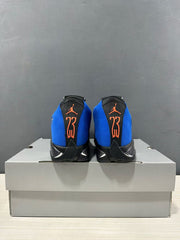 Rear view of the pair showing orange Jordan branding and the number 23 on black heel panels.