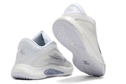 White and silver Nike A'ja Wilson 1 shoes showing the heel and outsole.