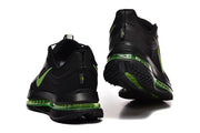 Rear view of black Nike Pegasus Premium shoes with green midsole accents