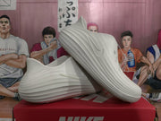 White sculpted slip-on clogs shown from the side