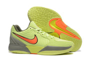 Pair of sneakers shown with the patterned yellow-green outsole and orange outsole accents visible.
