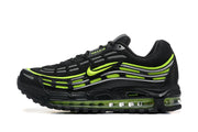 Side view of black Nike Air Max sneakers with volt and grey detailing