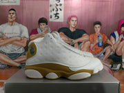 Side profile highlighting perforated white panels and the contrasting wheat midsole area.