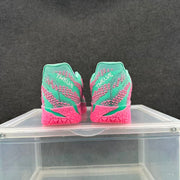 Rear view of the pair showing the blue-green heels, pink detailing, and visible heel branding.