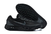 Black Nike Air Max sneakers shown from the side and underside, highlighting the textured outsole.