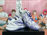 Pair of white and purple Nike basketball sneakers shown from a three-quarter angle.