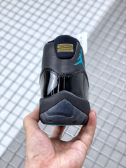 Rear view showing the black heel, blue Jumpman branding and yellow embroidered detail.
