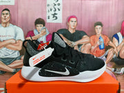 Side view showing the Nike Swoosh, black upper, gray collar panel, and white sole.