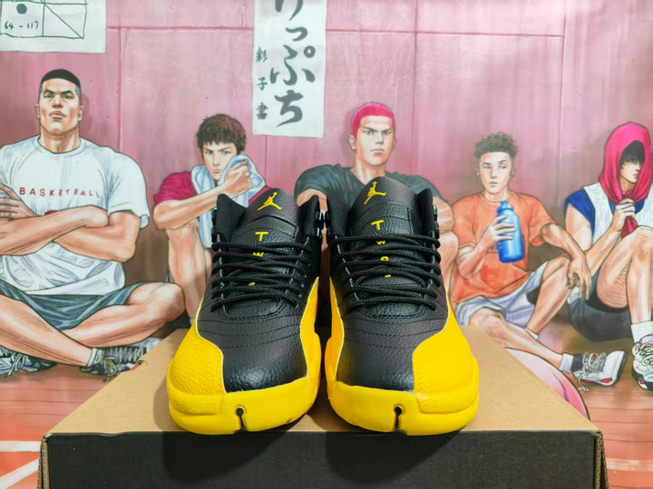 Front view of black and yellow high-top Jordan basketball sneakers displayed on a box.