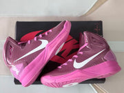 Two mauve and pink high-top basketball shoes shown at an angle on a box.