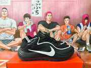 Side view of a black Nike basketball sneaker with white Swoosh accents