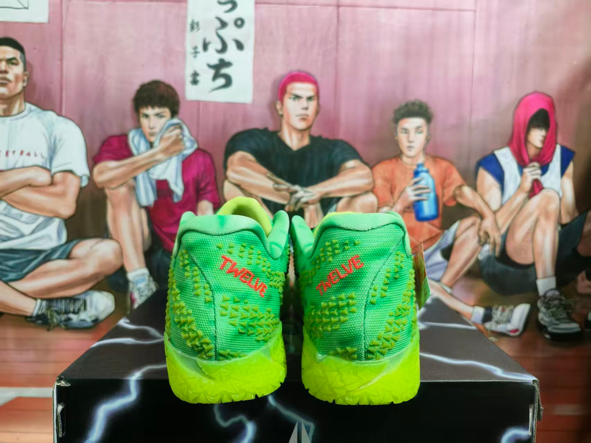 Rear view of bright green sneakers showing textured uppers, lime-green soles, and red TWELVE heel lettering.