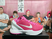 Side view showing the pink textured upper, white Swoosh, translucent heel detail, and white midsole.