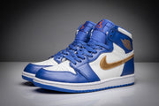 Pair of blue and white high-top sneakers with gold Swooshes and wing branding.