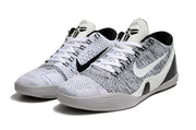 Pair of white and black Kobe 9 Low shoes shown from the front.