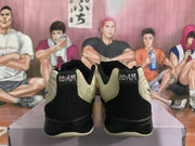 Rear view showing black heel panels, beige collar sections, and embroidered “12AM” details.