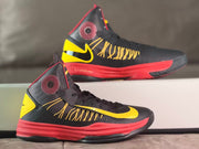 Two views of a high-top shoe with a yellow Swoosh and red midsole