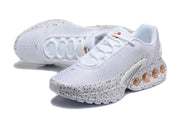 Pair of white and grey spotted Nike Air Max DN SE PRM sneakers shown from above and at an angle.