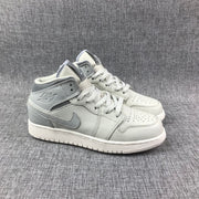 Three-quarter front view of the pair showing the perforated toe boxes, laces, collars, and outsoles.