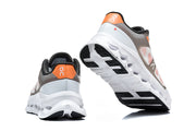 Rear and outsole views of On Cloudswift Remix shoes.