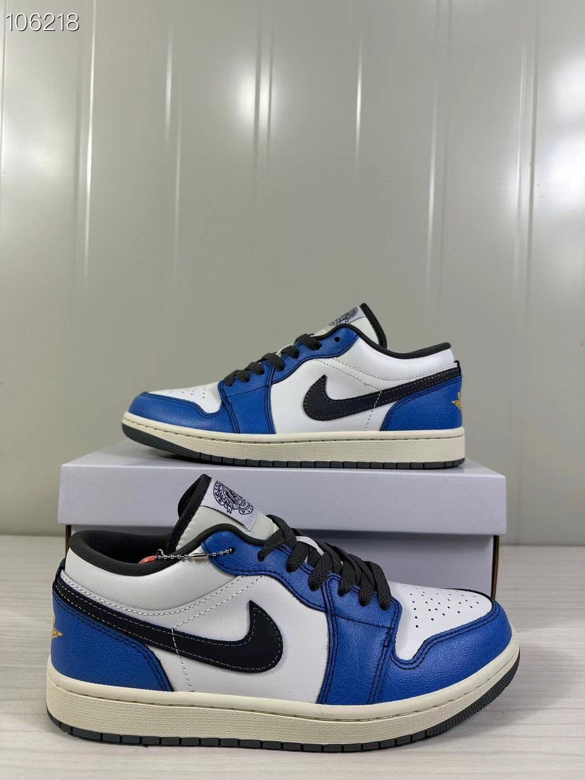 Pair of blue, white, and black low-top sneakers shown from the side.
