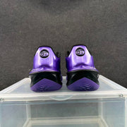 Rear view of the purple Nike sneakers showing black heel sections, purple outsoles and GT heel markings.