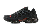 Side profile of a black Nike Air Max Terrascape Plus sneaker with red accents and visible sole cushioning.