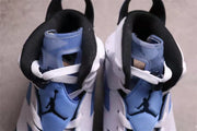 Top view showing the padded black collar, University Blue tongue, white laces, and Jumpman tongue branding.