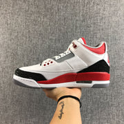 Opposite side profile of the white and red high-top sneaker with black heel detailing.