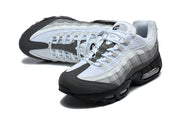 Top and angled view of grey and white Nike Air Max 95 TT sneakers