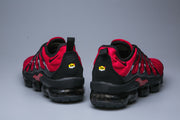Rear view of red and black Nike TN sneakers.