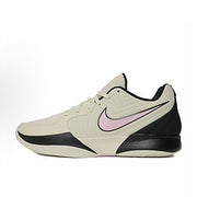Single cream-colored Nike Ja 2 basketball shoe with a pale pink Swoosh and black accents.
